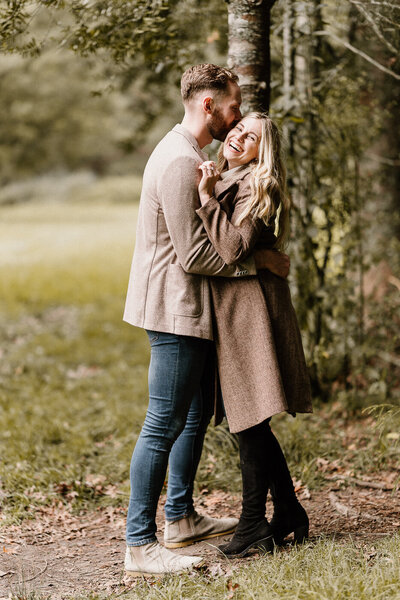 Engagement photography in Auckland at Riverhead Forest with a happy couple in love