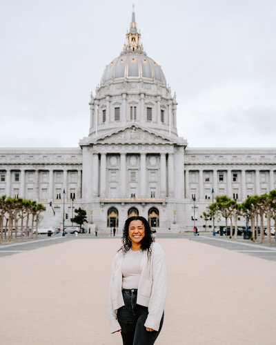 woman in front of city hall building