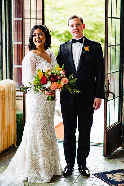A wedding couple standing side by side at the Ford Mansion in Toledo ohio