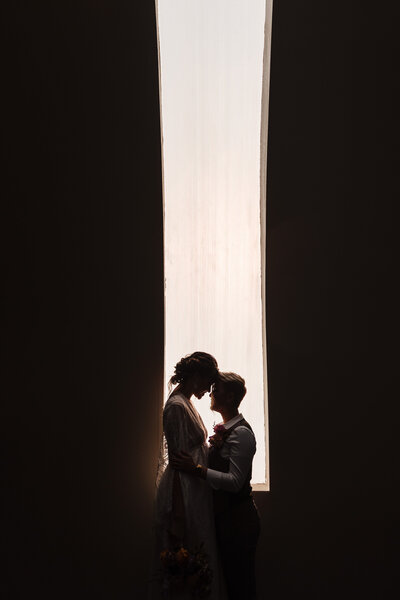 The front of the Barn through the trees at the Posey Meadows Wedding Venue in San Marcos, Texas.