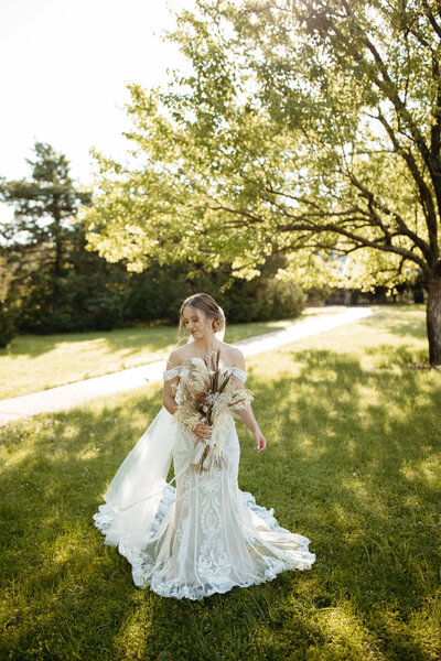 Bride is posing for bridal portraits in her wedding dress at great plains nature center in Wichita Kansas - Ashley Cole Photography
