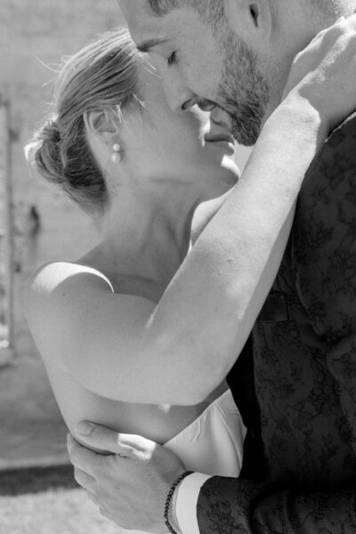 bride & groom joyfully smiling at the camera