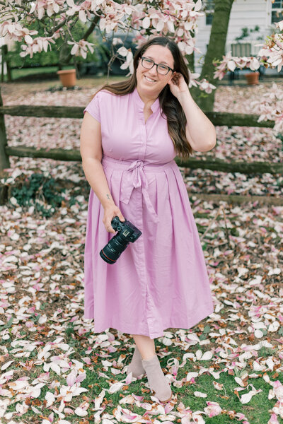 Katie Fri Photography smiling while holding camera