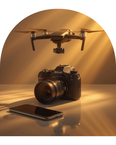 Pack professionnel photo et vidéo comprenant un drone, un appareil photo et un smartphone dans une lumière dorée, illustrant les prestations de création visuelle de Lili Créa Design à Saint-Nazaire en Loire-Atlantique