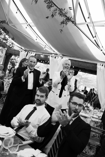 An editorial style bride smiling leaning up against a gold staircase at a hotel in Chicago, Illinois. 
