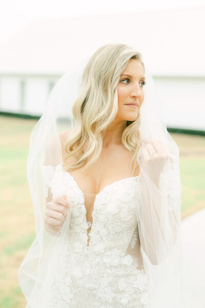 bride outside the farmhouse wedding venue