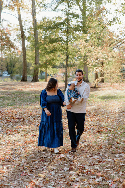 A mom, dad, and daughter walking towards me