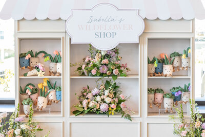 Party favor wall of stuffed succulents for birthday party planned by Fancy Chancey in San Diego CA