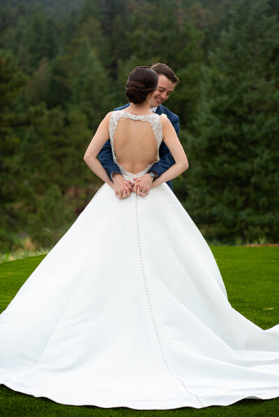 a bride kissing the grooms cheek
