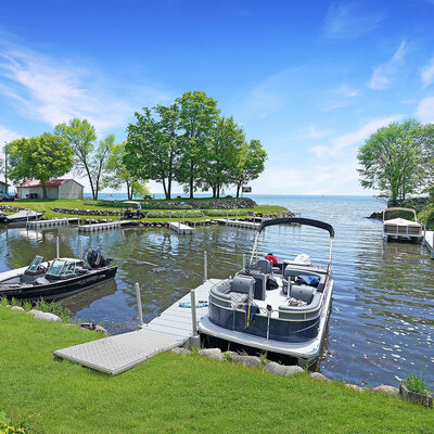 A pontoon sitting in the harbor at Doc's Harbor RV Resort.