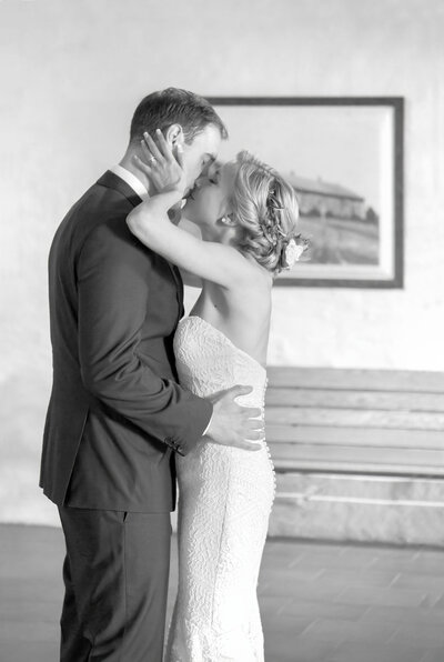 A bride and groom kiss in Finland during their first dance
