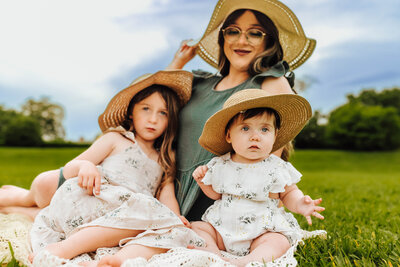 Mommy and her two daughters  at the Baton Rouge State Capitol grounds
