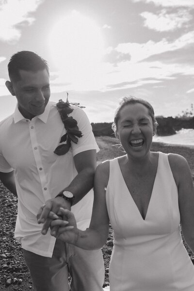 bride and groom on beach in hawaii