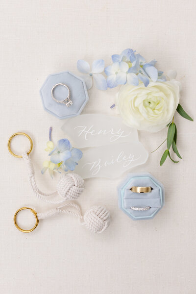 Flatlay photo with sea glass place cards with calligraphy