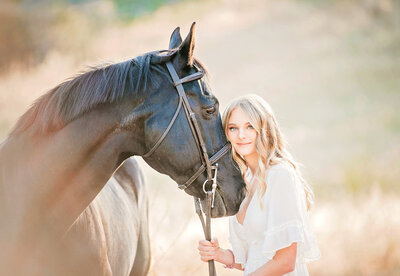 Gorgeous san diego senior photography session with a girl and her horse on a trail