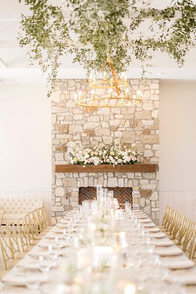 White and green floral head table designed by Collected Co Wedding Planning at Equestria West