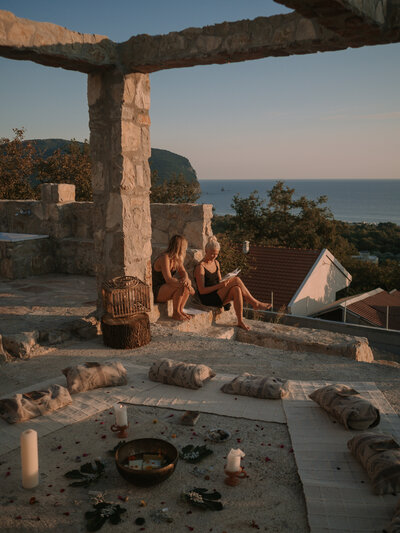 two girls reading while on a yoga retreat in Montenegro