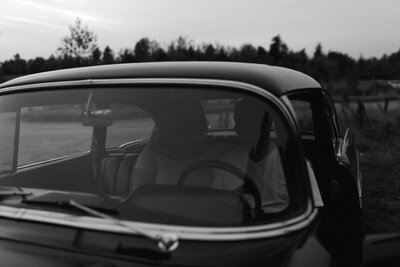 couple sitting in a vintage car