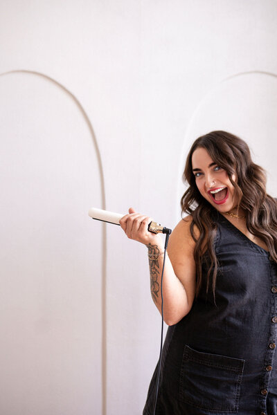 Hands-on hairstylist perfecting a seamless hair extension blend