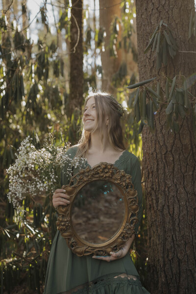 Devin holding a mirror