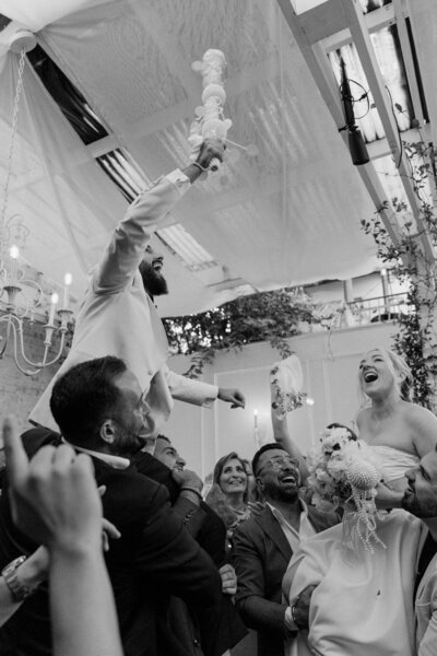 Couple and guests celebrating their marriage