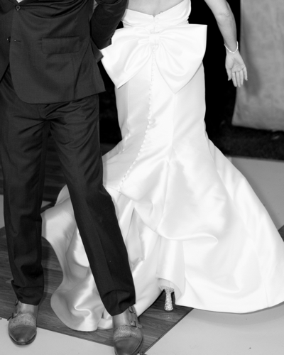 Black and white wedding photo featuring groom and bride | Megan Smith Photo