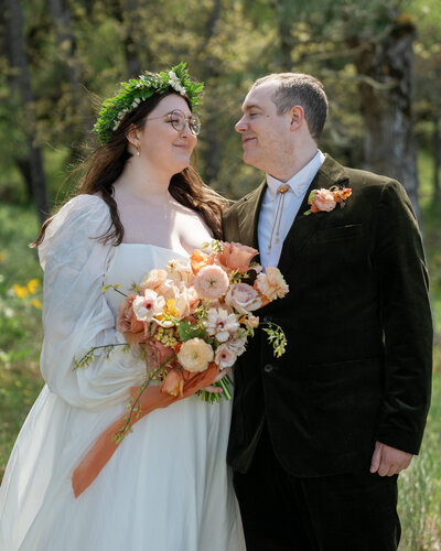 Bride & Groom smiling lovingly at each other on their PNW elopement day