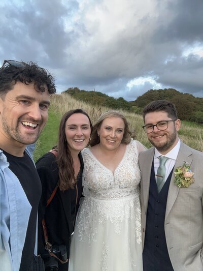Amy & Nick posing with couple