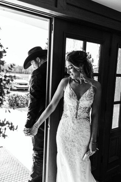 Bride and Groom holding hands at Diamond Springs Wedding Venue in Wichita KS