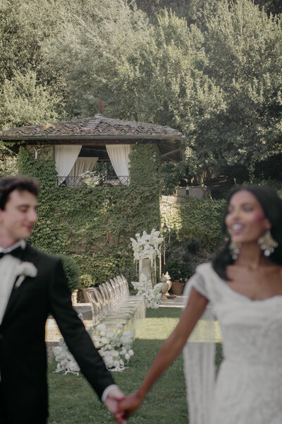Motion blur photo of bride and groom holding hands in Portifino, Italy