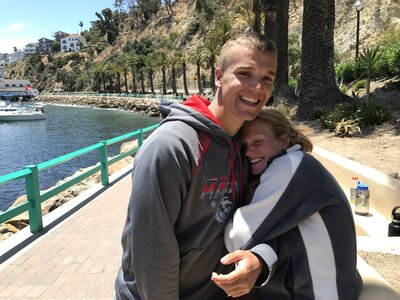 Couple snuggled in after getting engaged in Catalina Island California
