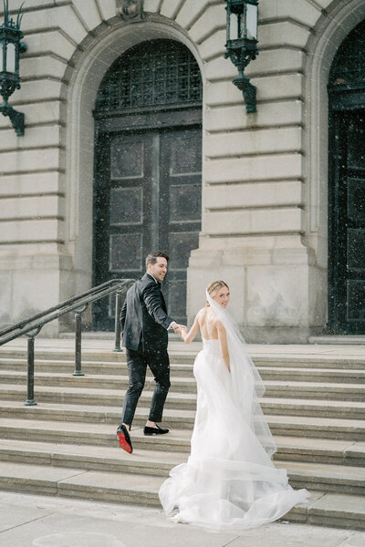 Bride and groom walk up memorial steps at their DC wedding