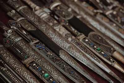 Amulet knives or daggers with intricate design patterns and colored gems