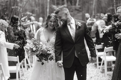 birde and groom have confetti thrown on them after wedding ceremony photo by cait fletcher photography