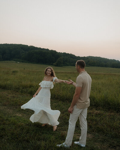 golden hour couples photoshoot in a grassy field