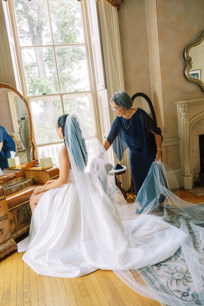 Mother of bride puts in veil at Glen Foerd Estate in Philadelphia, PA