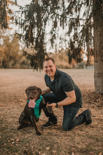 man smiling with dog