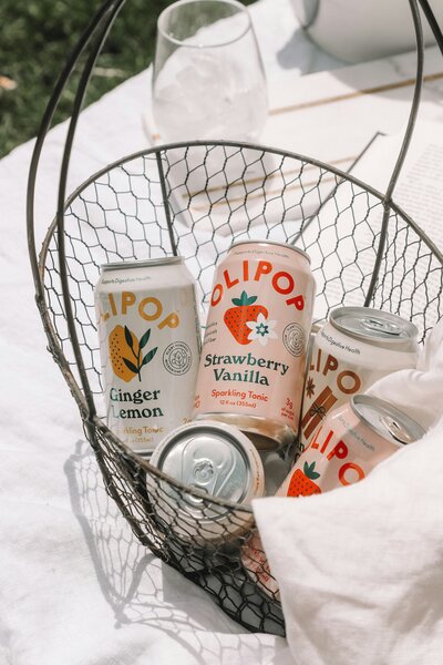 A bowl of Olipop drinks