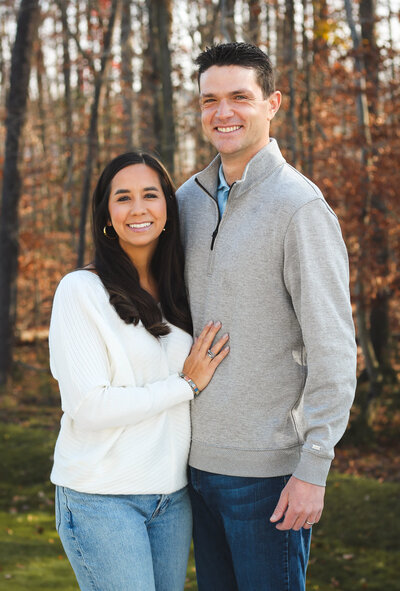 Couple posing in the woods 