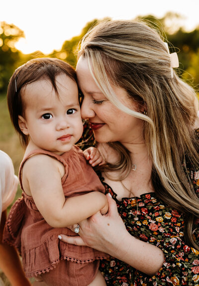 Expecting mom showcasing a beautiful dress from Paula Gofroth's client closet while enjoy a pleasant day in a park in Lake Worth, Texas