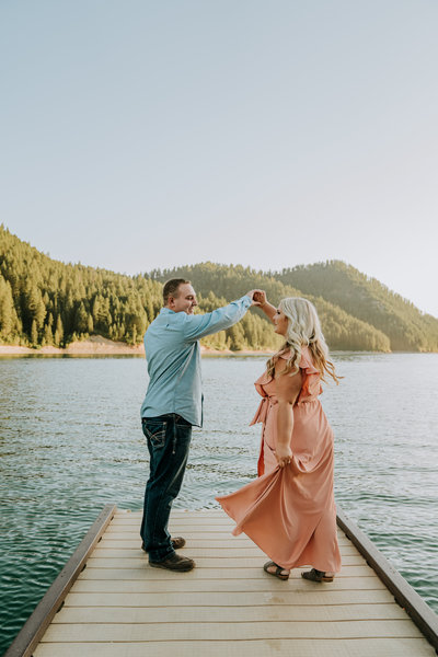 couple dancing by a lake