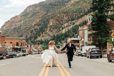 Boulder Wedding Photographer captures grooms holding hands after elopement