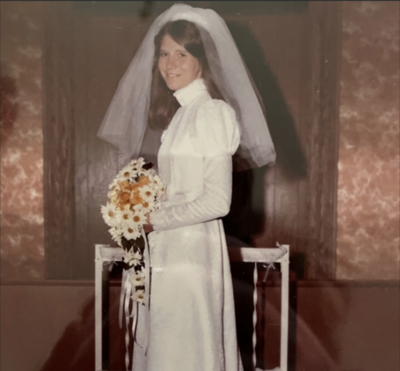 Wedding gown preserved in a display box with lace details