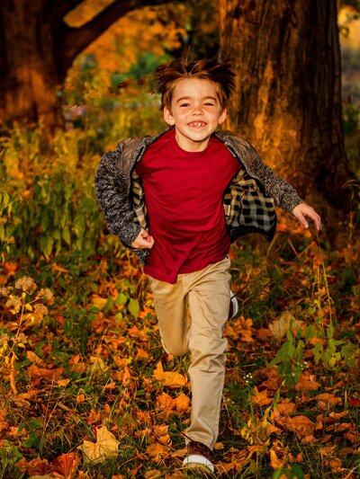 Boy running and smiling at Side Cut Metroparks