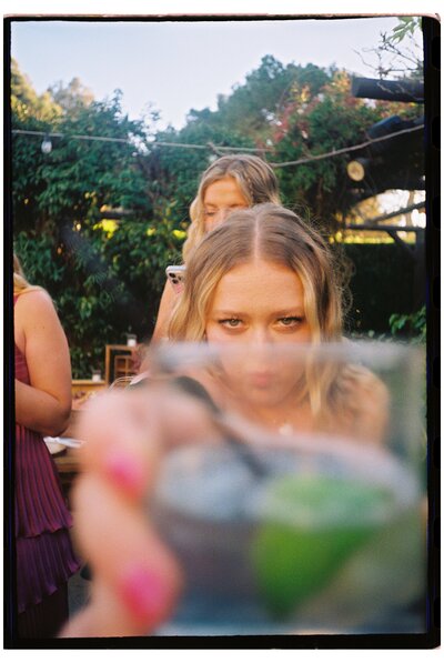 bride holding out drink taken by wedding photographer tampa fl