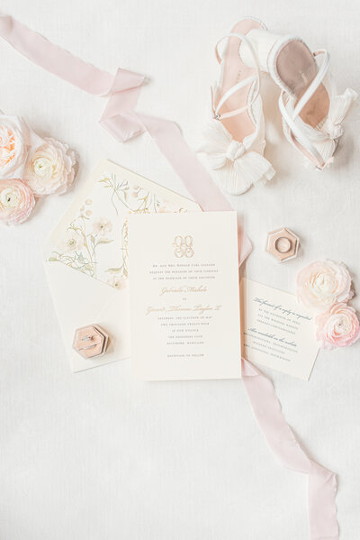 classy invitation suitr with flowers and accessories pink blush