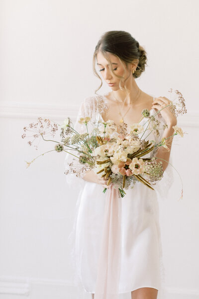 girl standing with flowers