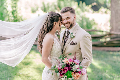 A bride and groom share a sweet moment with foreheads together during their Catholic wedding at Historic Blenheim in Fairfax, Northern Virginia