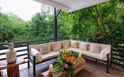 an outdoor seating area at the retreat center in costa rica 