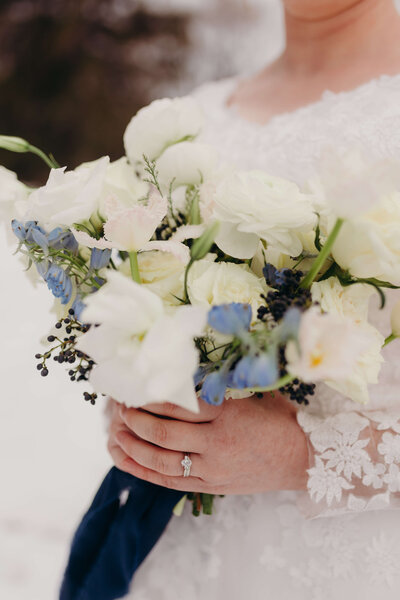 close up of white and blue bridal bouquet